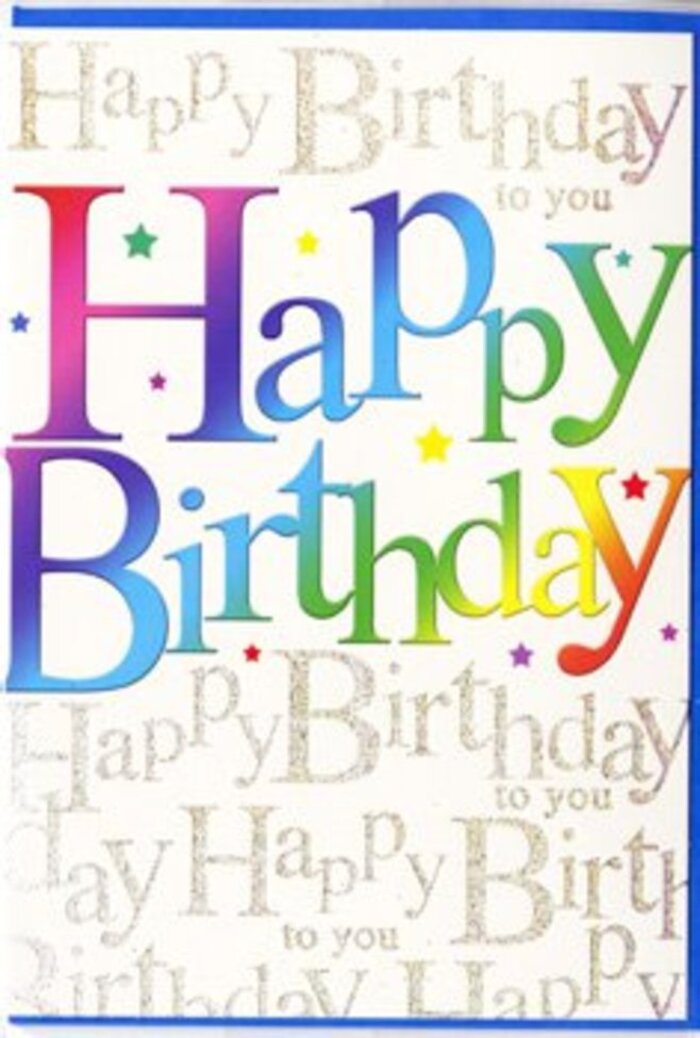 The image shows a joyful birthday card that looks ready to be set beside a vase of fresh flowers on a table in an Old Oak Common living room. Dominating the design are the words Happy Birthday, displayed in large, bold letters stretched across the front. Each letter is soaked in its own colour, moving gradually from deep cherry red to warm tangerine, sunny yellow, lively spring green, soft turquoise, strong royal blue, and finally a rich, velvety purple. The transitions between colours are smooth and painterly, evoking the careful blending of tones in a thoughtfully arranged floral display. The lettering style is softly rounded and approachable, imparting a sense of friendliness and warmth that suits any age group. Behind these standout words, the background is completely filled with a repeating script that reads Happy Birthday to you in a smaller, more delicate hand. This script is rendered in shimmering gold, with a fine, glitter-like or foiled appearance that catches and reflects light in a subtle way, much like evening sun glancing off windows of homes near Old Oak Common Lane. The repeating script creates a gently textured effect, adding depth without distracting from the main message. Scattered across the card are little accents-tiny stars and dots in matching bright colours-that resemble confetti falling during a birthday toast. The card's surface looks smooth to the touch, with a gentle sheen that enhances the intensity of the colours while maintaining a polished, celebratory finish. It feels like a card chosen with care, perfect for slipping into a bouquet delivery across Old Oak Common to mark someone's special day with genuine, colourful joy.
